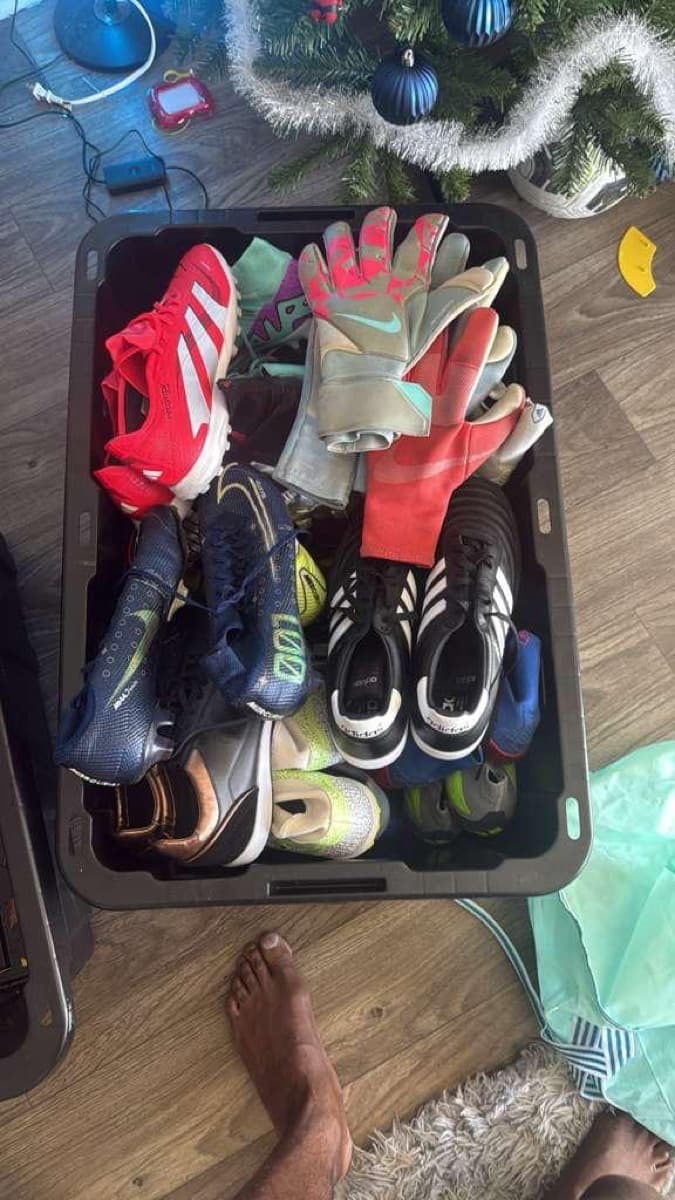 Bins of football gear packed for travel